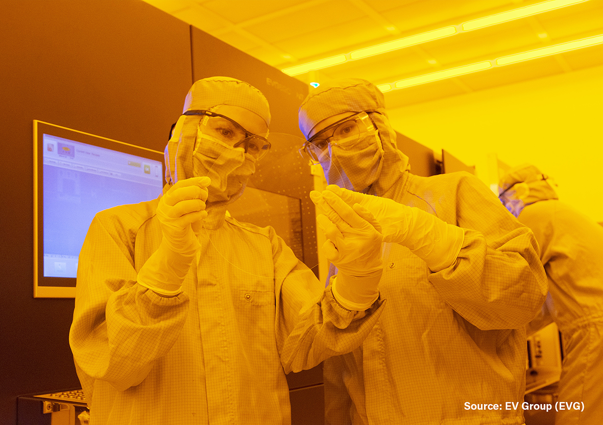 Process engineers at EV Group’s NILPhotonics® Competence Center examine a 200-mm wafer with metalenses replicated using a master manufactured by Toppan Photomask and a nanoimprint lithography (NIL) process from EVG. Source: EV Group.